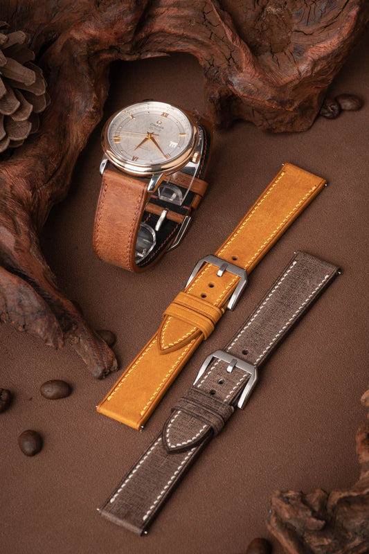 Handcrafted Babele flannel-textured calfskin straps with linen-like finish, compatible with Omega Seamaster 300, Rolex Submariner & Panerai Luminor. 6 colors (espresso/slate/ivory), 2.0mm quick-release spring bars, 3.5mm French edge stitching. Custom engraving/stitch color/length for refined business-casual styling.