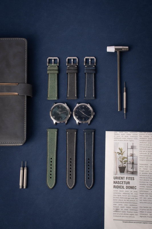 Handcrafted Babele flannel-textured calfskin straps with linen-like finish, compatible with Omega Seamaster, Rolex Datejust & Panerai Luminor. 2.0mm quick-release spring bars, espresso/orange color options, 3.5mm French edge stitching. Custom engraving/stitch color for business-casual styling.